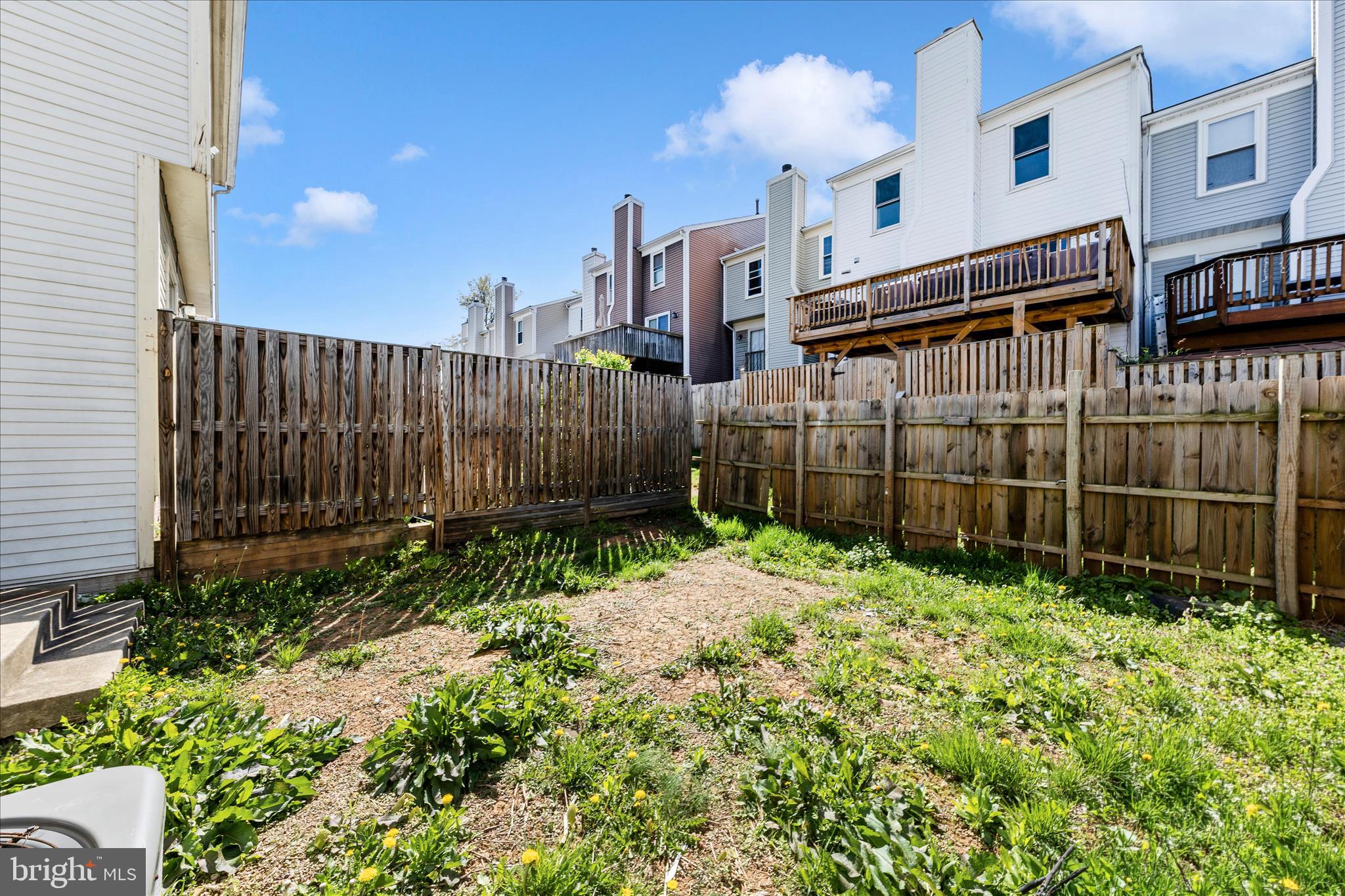 13303 Country Ridge Drive Germantown, MD 20874 - Photo 40 of 45 a backyard of a house with lots of green space