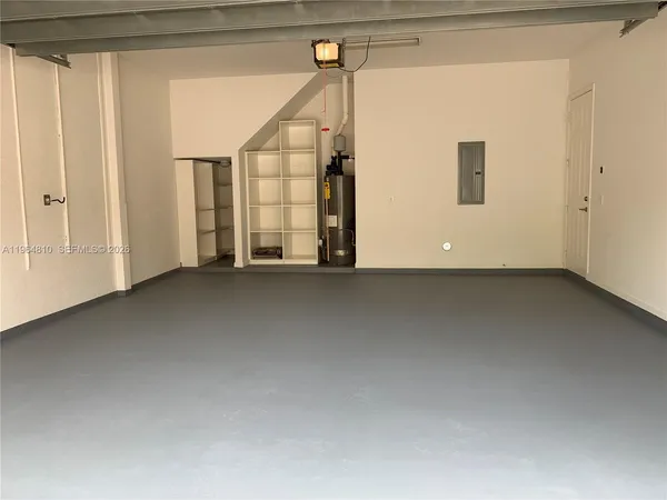 a view of a big room with closet and windows