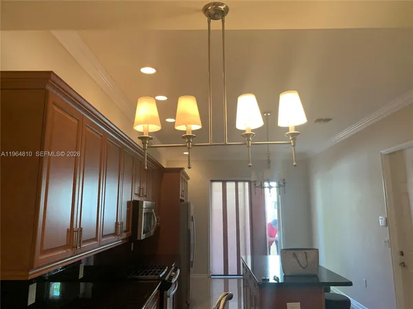 a view of staircase and kitchen view