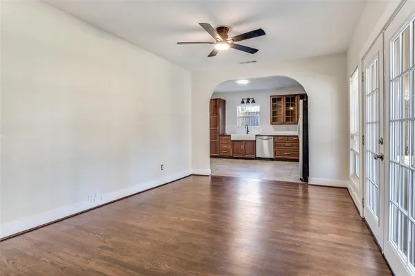 wooden floor in an empty room with a window