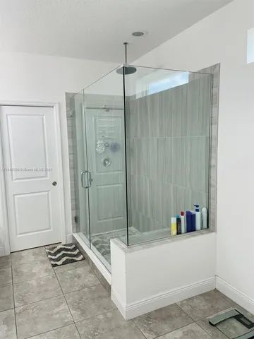 a bathroom with a tub and shower