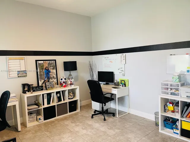 a view of a workspace with furniture