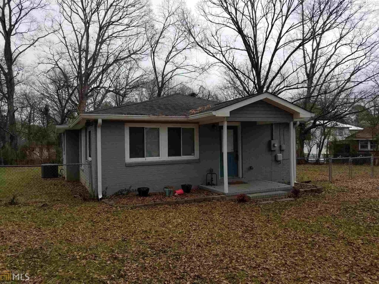 22 Betty Kay Avenue Rome, GA 30165 - Photo 1 of 1 a house with trees in front of it