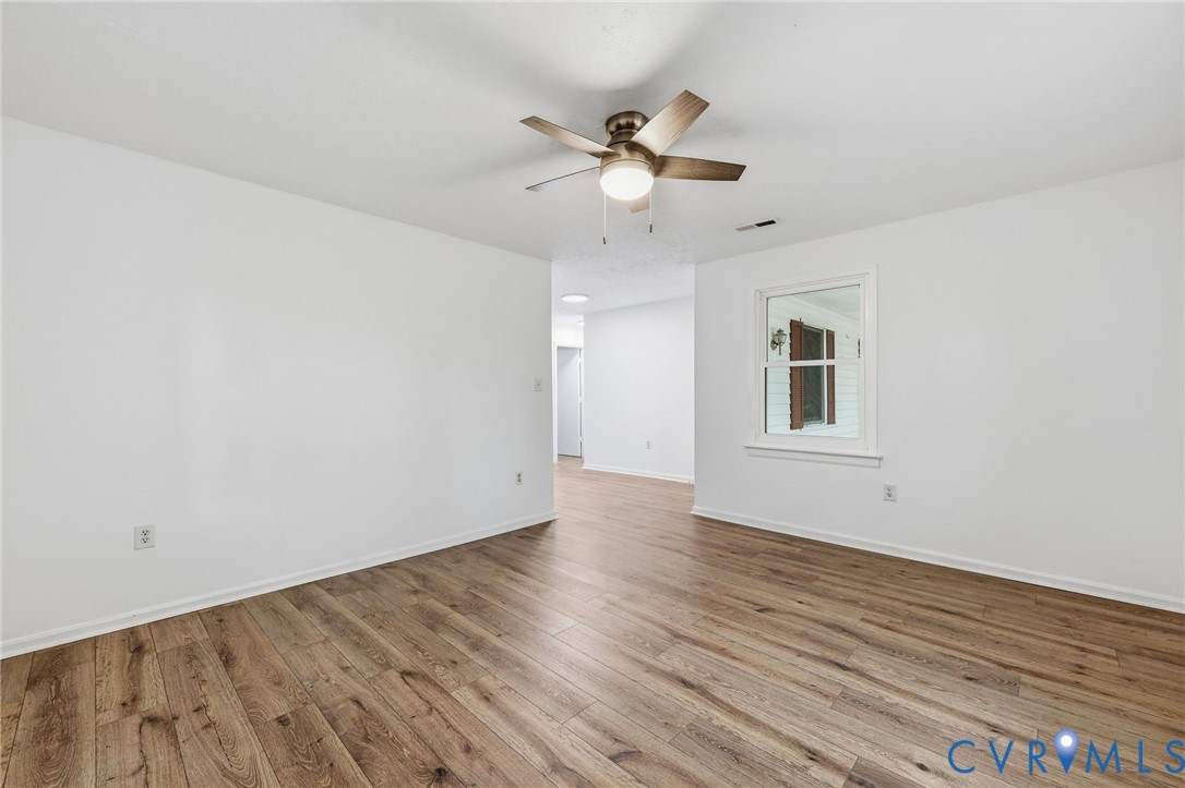 3220 Greenway Road Gladstone, VA 24553 - Photo 8 of 29 a view of an empty room with wooden floor and a window