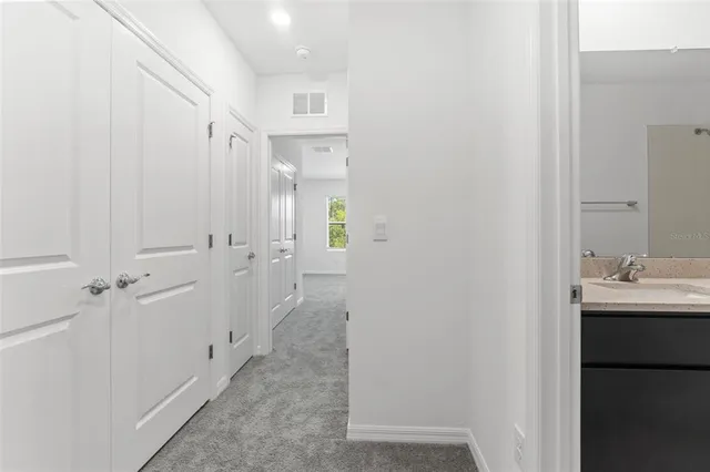 a bathroom with a sink and mirror
