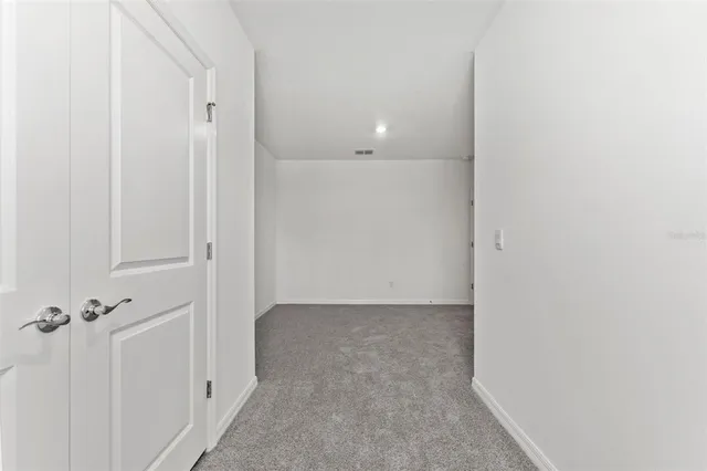 a bathroom with a granite countertop sink a toilet and bathtub