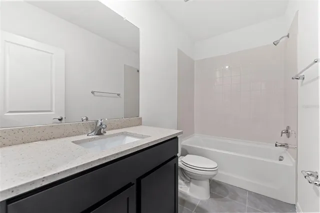 a bathroom with a bathtub and toilet