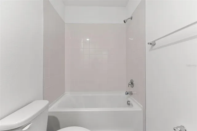 a view of a hallway with windows