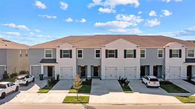 an aerial view of a house with a swimming pool