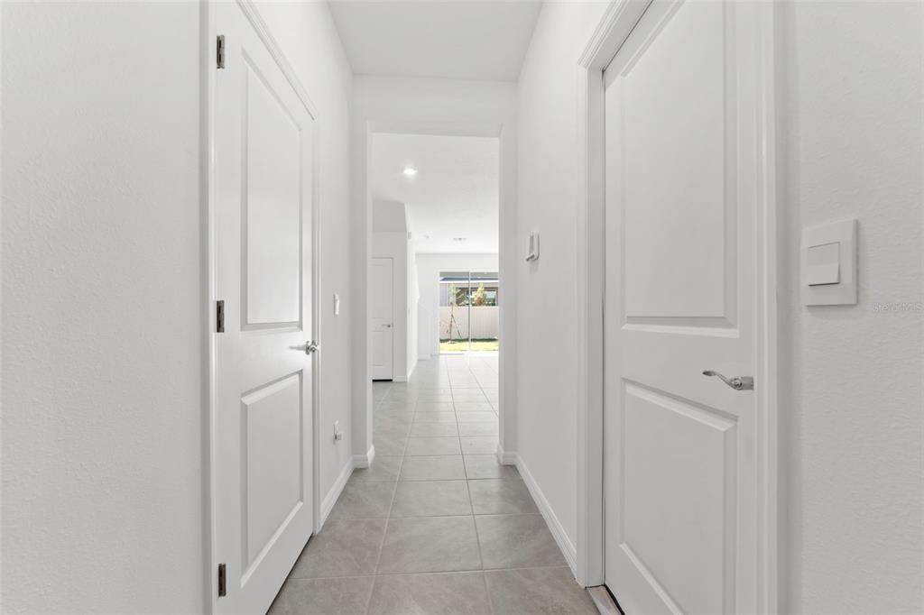 31336 Paper Birch Street Wesley Chapel, FL 33545 - Photo 4 of 38 a view of a hallway with wooden shelves