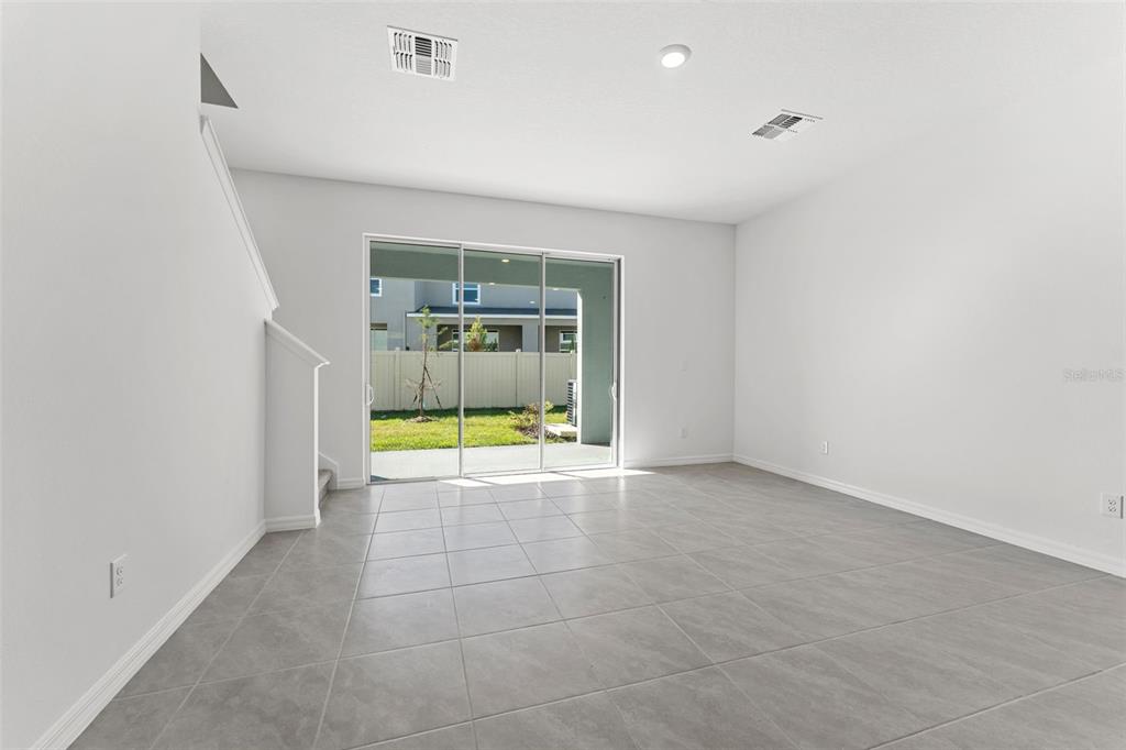 31336 Paper Birch Street Wesley Chapel, FL 33545 - Photo 7 of 38 a view of an empty room with a window