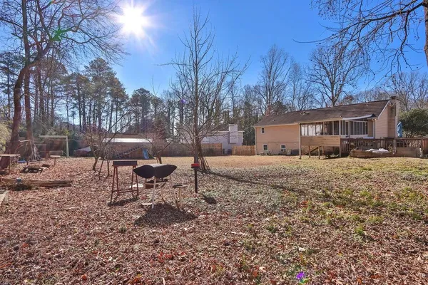 a view of a house with a yard covered with snow in the outdoor