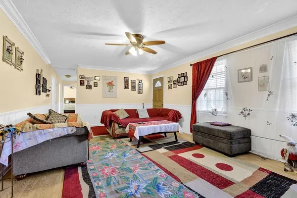 a bedroom with furniture and a window