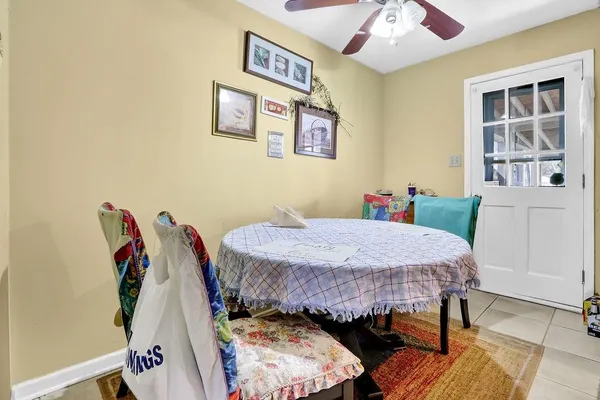 a bed room with a bed and a chair