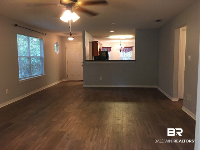 226 Montclair Loop Daphne, AL 36526 - Photo 9 of 27 226 Montclair Loop | Lake Forest | Tile Floor | LVT Flooring | Black Appliances | Back Deck