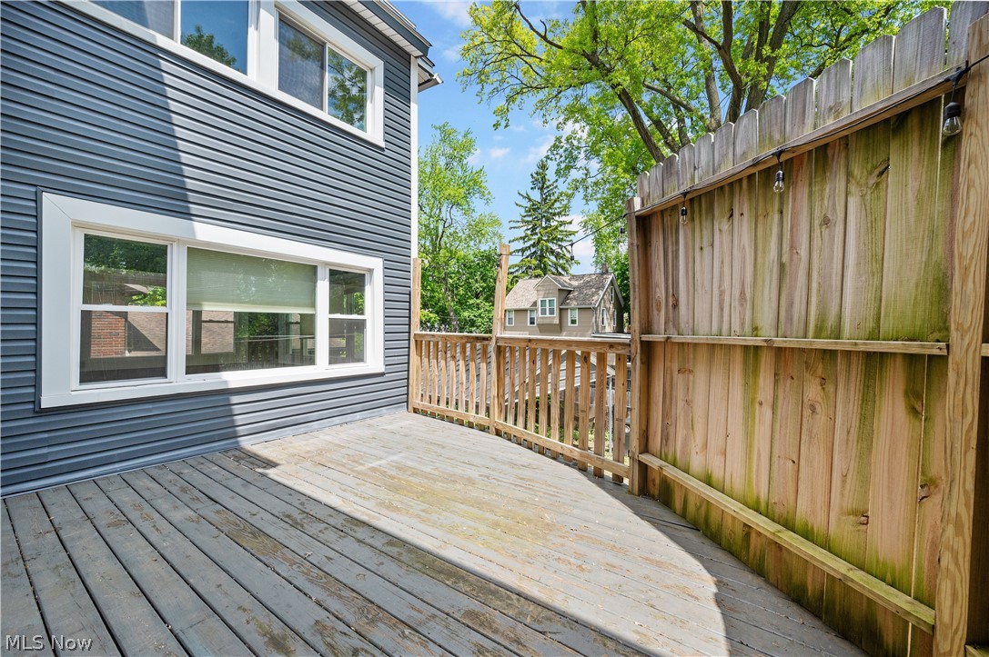 371 Merriman Road Akron, OH 44303 - Photo 11 of 27 Exterior deck area featuring wood flooring and a perimeter wood fence