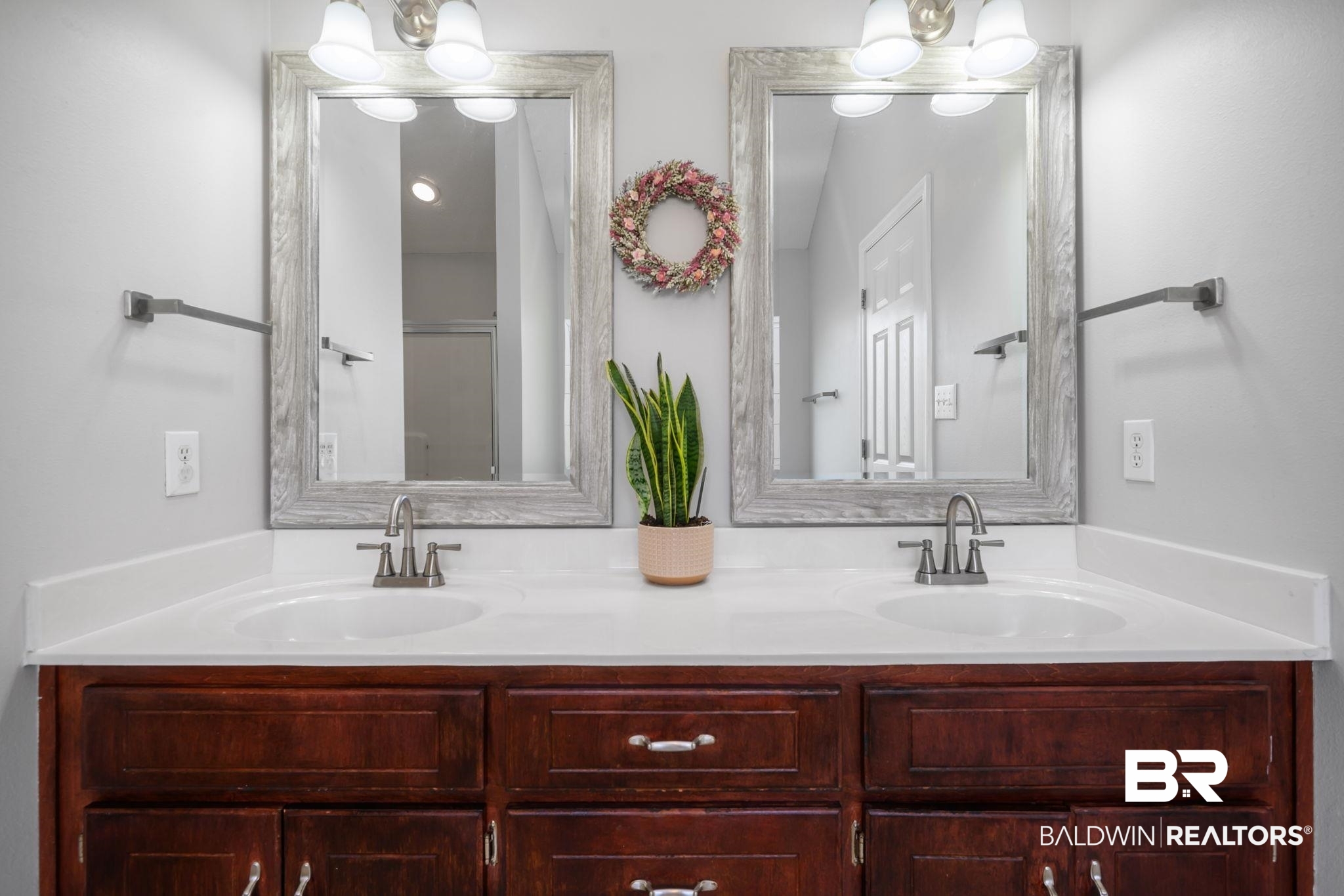 9422 Labrador Run South Mobile, AL 36695 - Photo 20 of 36 Dual vanity with recessed sinks, brushed nickel faucets, and coordinating wood-grain framed mirrors