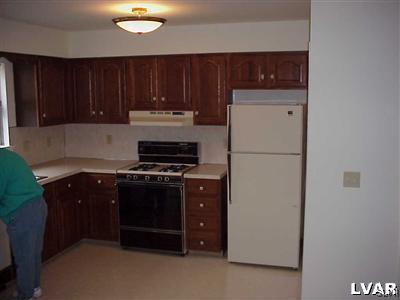307 South Twelfth Street Emmaus, PA 18049 - Photo 2 of 4 a kitchen with a refrigerator and a stove