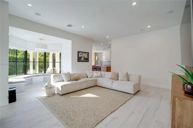a bathroom with a toilet a sink and a mirror