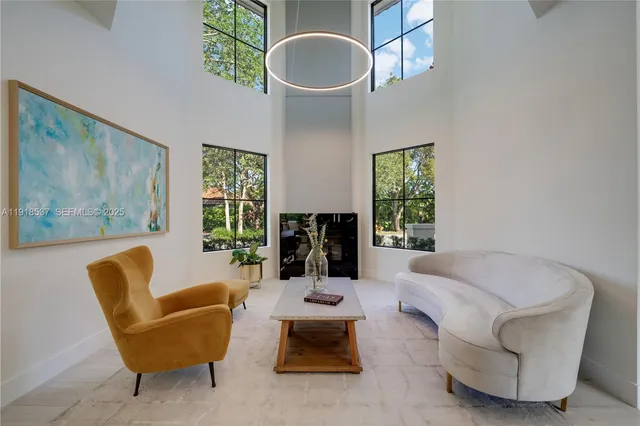 a dining room with furniture window and entryway