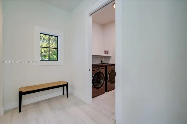 a bedroom with a large bed and a large window