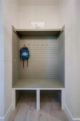 a bathroom with a shower and a glass door