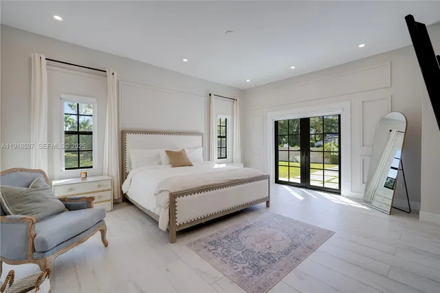 a bedroom with two beds and a table