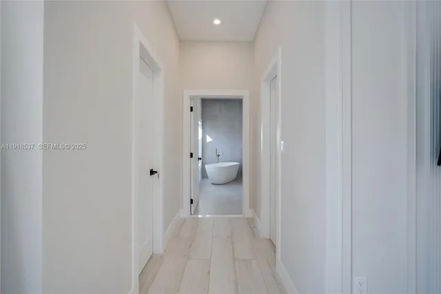 a bathroom with a granite countertop sink a toilet and a mirror