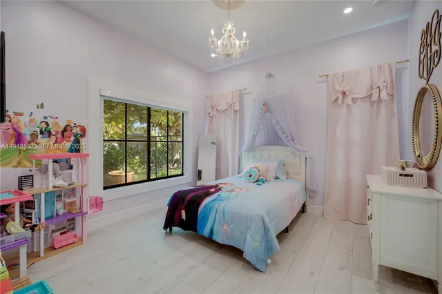 a bathroom with a granite countertop sink a toilet and a mirror
