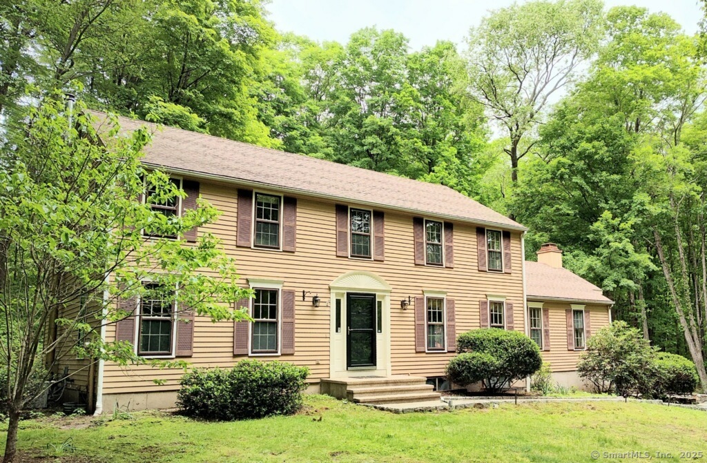 15 Packer Brook Road Redding, CT 06896 - Photo 1 of 1 a front view of a house with a yard