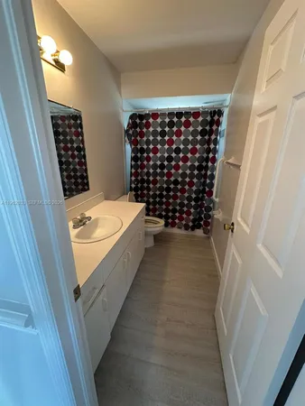 a bathroom with a bathtub and shower