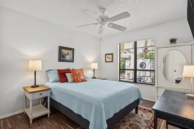 a bedroom with a bed and a lamp