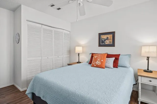 a bedroom with furniture and a large window