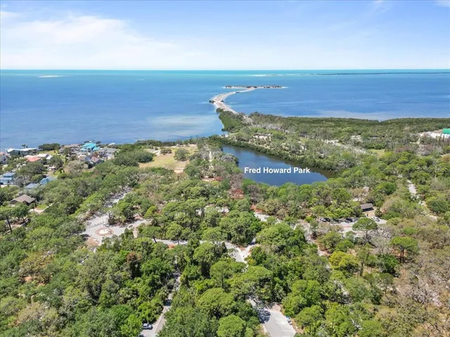 an aerial view of a house with a lake view