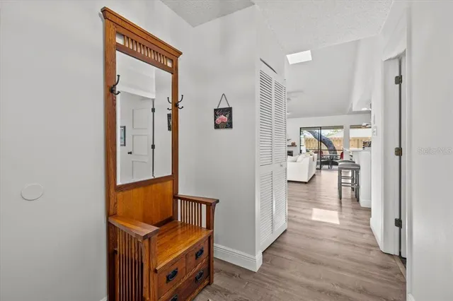 a view of hallway with livingroom and furniture