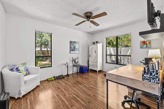 a bed room with a bed window and a table