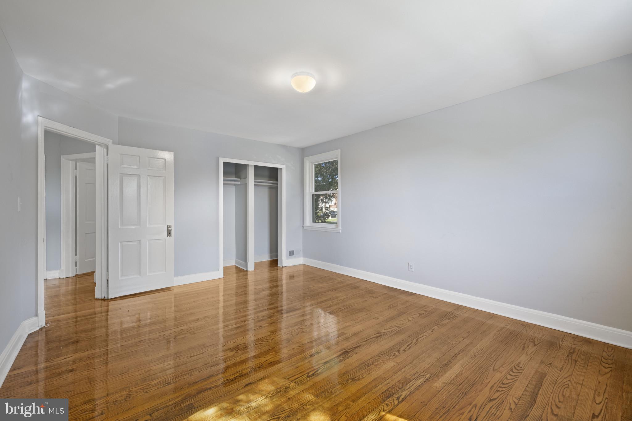 1516 East 36th Street Baltimore, MD 21218 - Photo 15 of 33 a view of an empty room with wooden floor