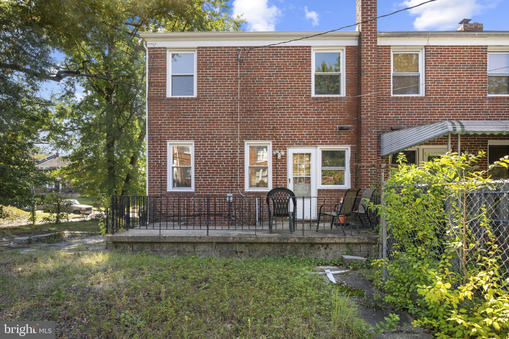 1516 East 36th Street Baltimore, MD 21218 - Photo 28 of 33 a front view of house with yard and outdoor seating