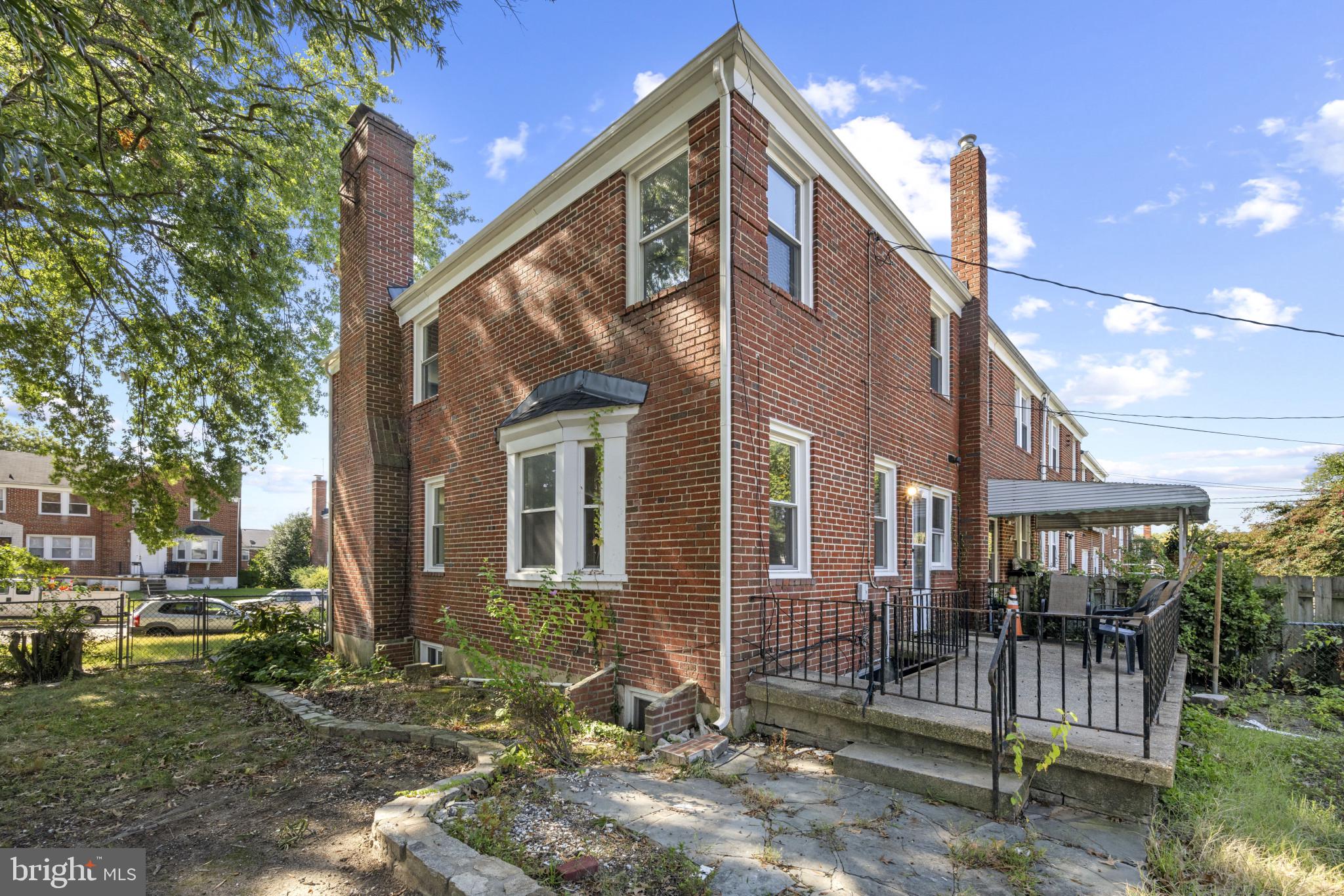 1516 East 36th Street Baltimore, MD 21218 - Photo 30 of 33 a view of a house with a yard