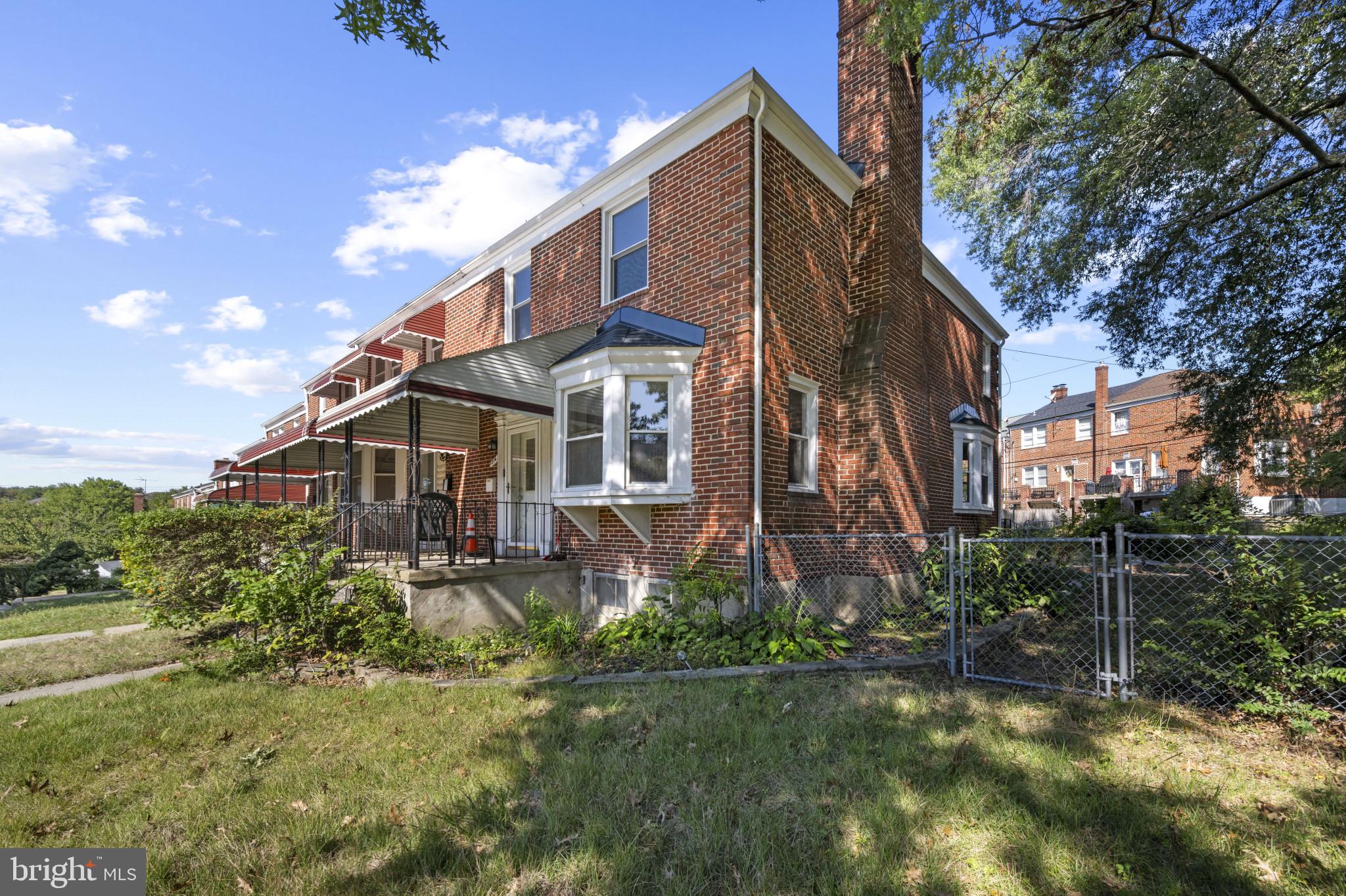 1516 East 36th Street Baltimore, MD 21218 - Photo 31 of 33 a view of a house with a yard