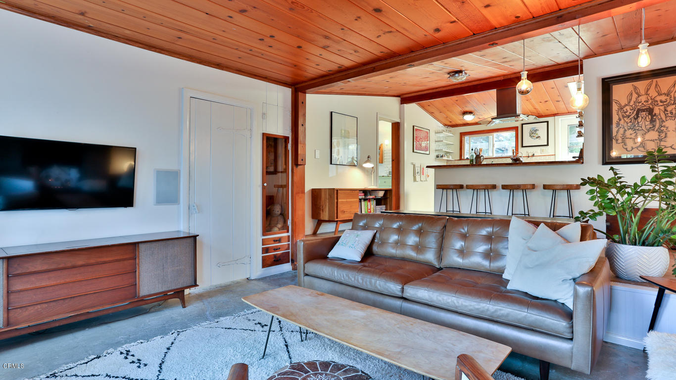 9525 Reverie Road Tujunga, CA 91042 - Photo 7 of 47 a living room with furniture and a flat screen tv