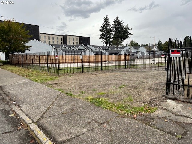 16119 Southeast Stark Street Portland, OR 97233 - Photo 2 of 12 a view of a yard in front of a house