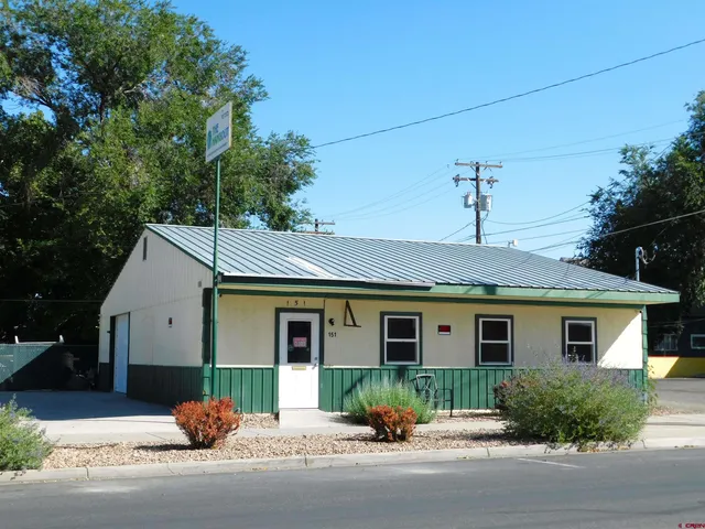 a front view of a house with a garage