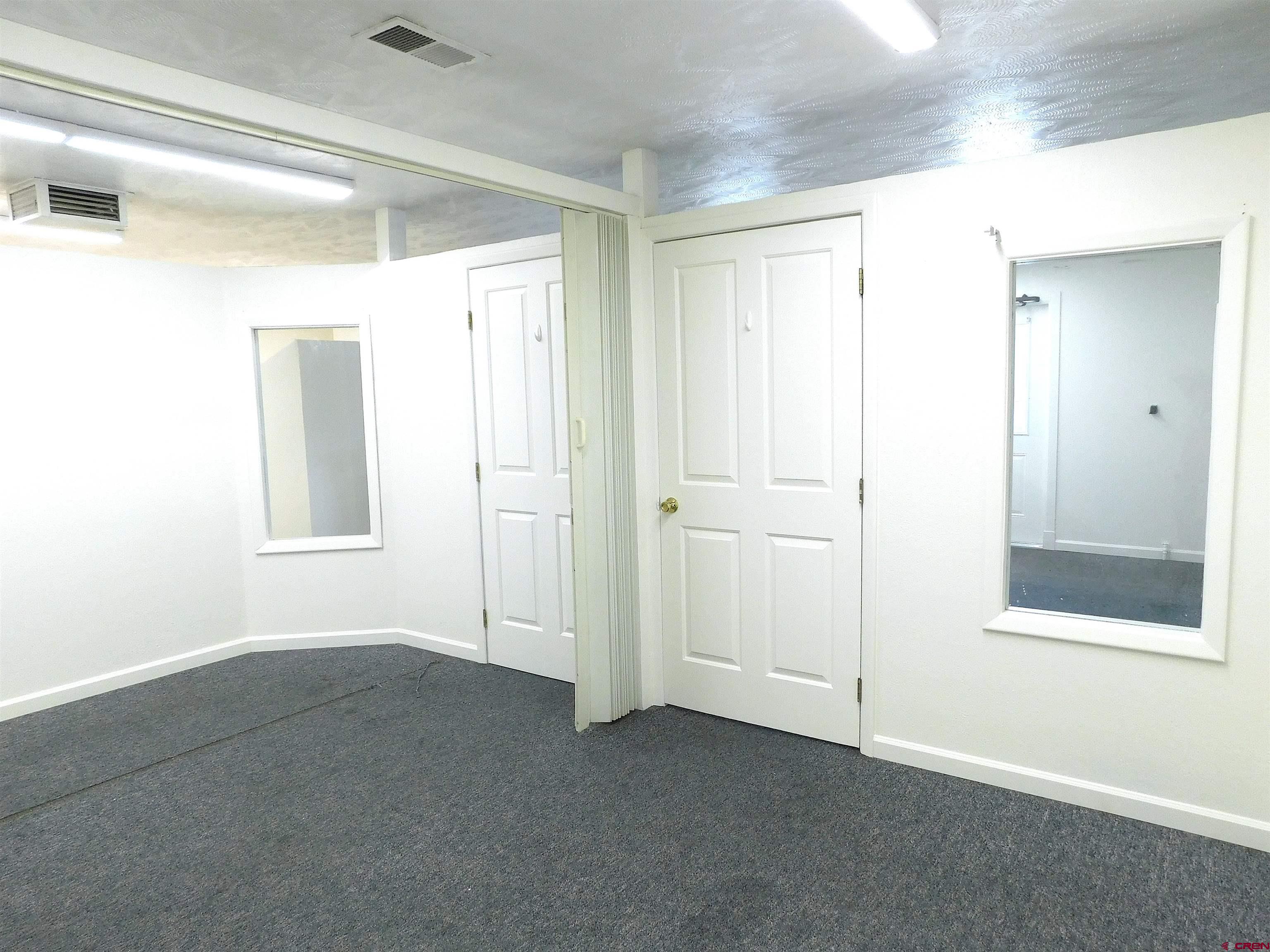 151 West 2nd Street Delta, CO 81416 - Photo 15 of 33 a view of an empty room with window and closet area