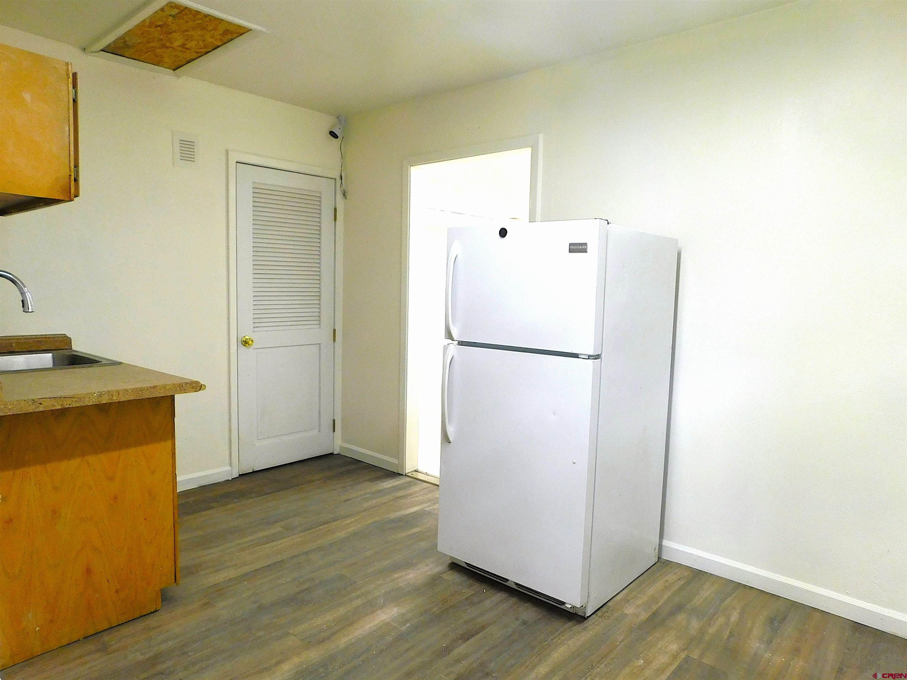 151 West 2nd Street Delta, CO 81416 - Photo 23 of 33 a utility room with wooden floor washer and dryer