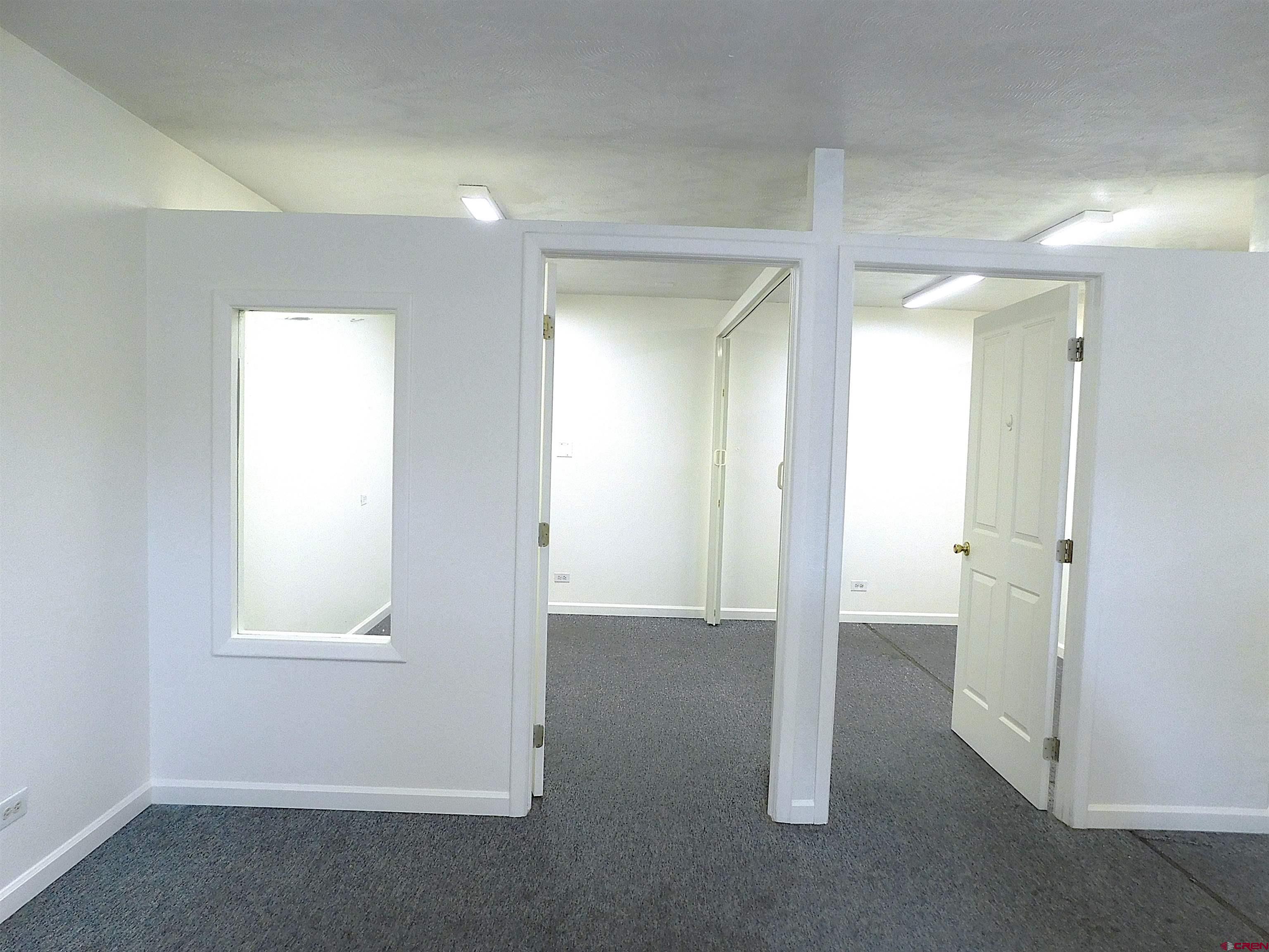 151 West 2nd Street Delta, CO 81416 - Photo 10 of 33 an empty room with windows and closet
