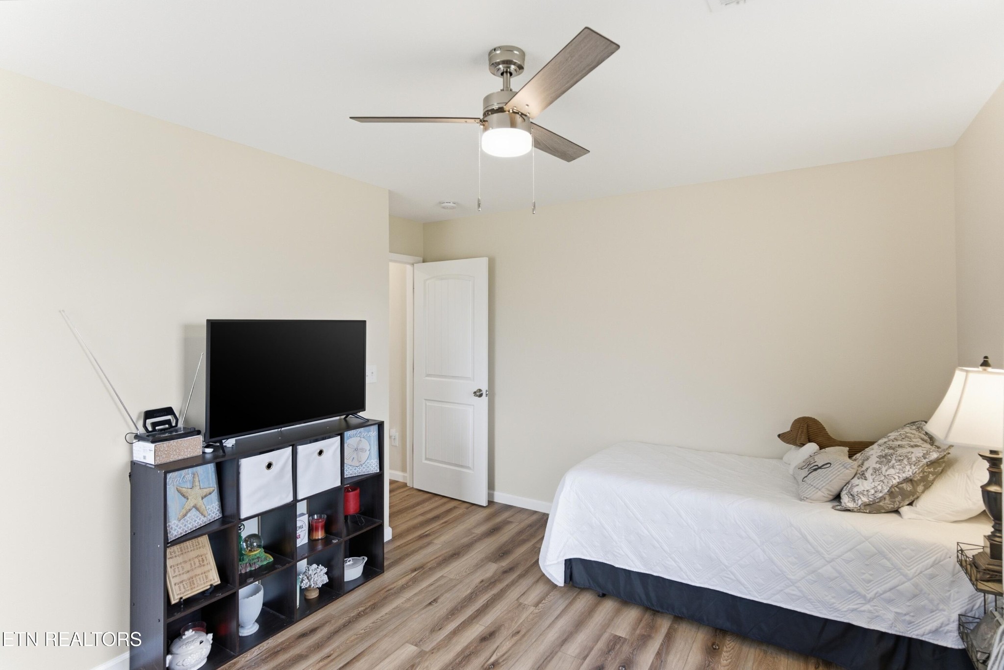 6911 Fairview Road Corryton, TN 37721 - Photo 17 of 30 a bedroom with a bed and a flat screen tv