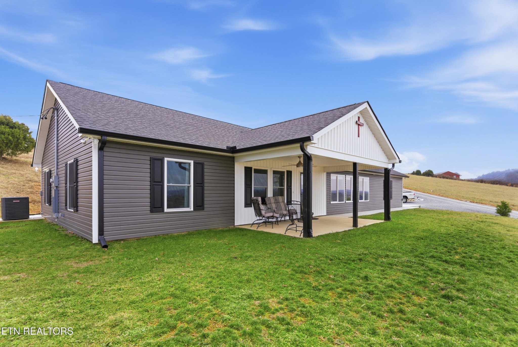 6911 Fairview Road Corryton, TN 37721 - Photo 30 of 30 a view of a house with a yard and sitting area