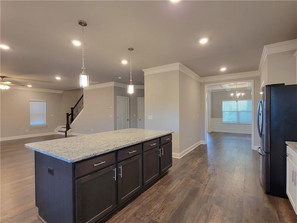 1866 Castleberry Drive Buford, GA 30518 - Photo 6 of 11 a kitchen with a wooden floor and a sink