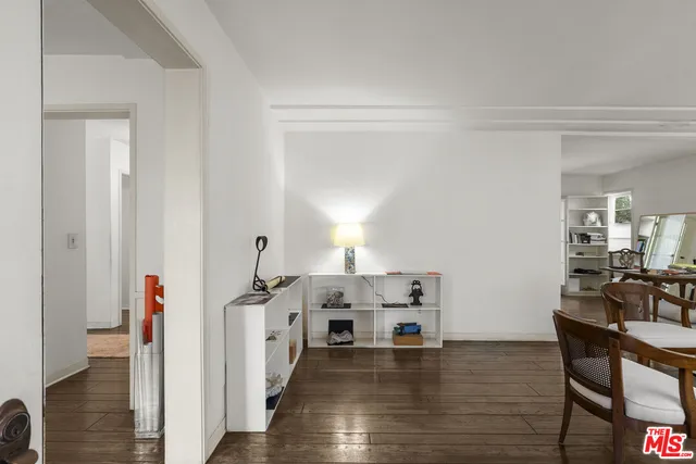 a view of a workspace with wooden floor